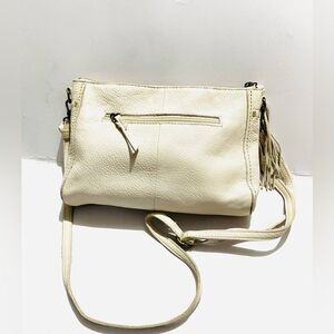 The Sak leader exterior crossbody bag happy and free beige tassel